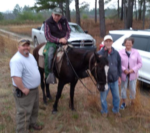 From left: Lee Crisco, Earl Drew (on horse), Jeff and Donna Ruth