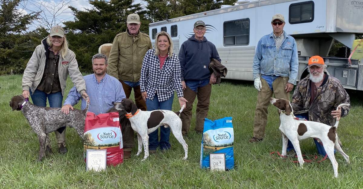 Open Shooting Dog Stake Winners. From left to right: Jess Hann with Perfections Huckleberry, Christopher Yancy, Charles Beeler, Shannon Yancy, Judges Tim Penn and Jack Glover; and Jim Giles with Mercer County Erin's Mike