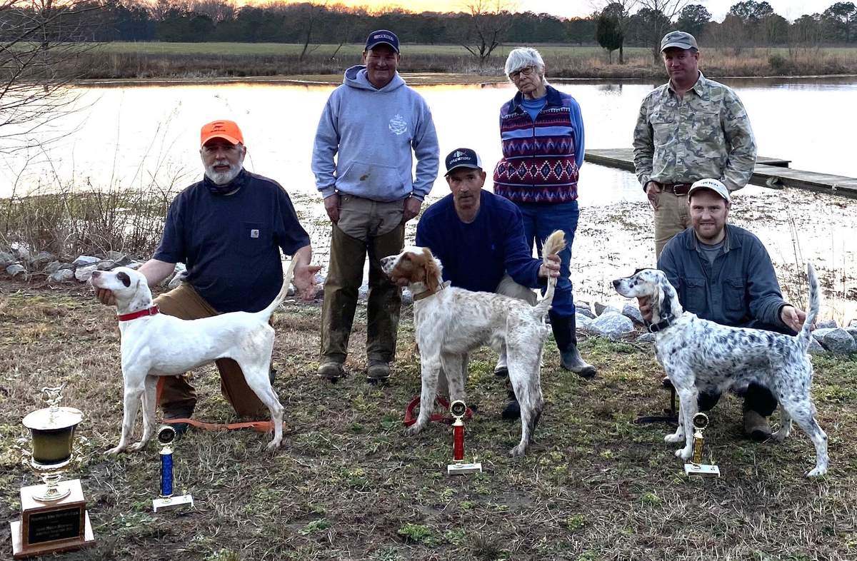Open Shooting Dog Stake Winners. From left: Pirate's Mean Louise with  Dennis Kivikko, Chippoke's Hoss Man with Lee Flanders and Phillips Half Moon with Matthew Phillips. Standing: Judge Rob McGuire, Barbel Fetkoter and Judge Parke Brinkley